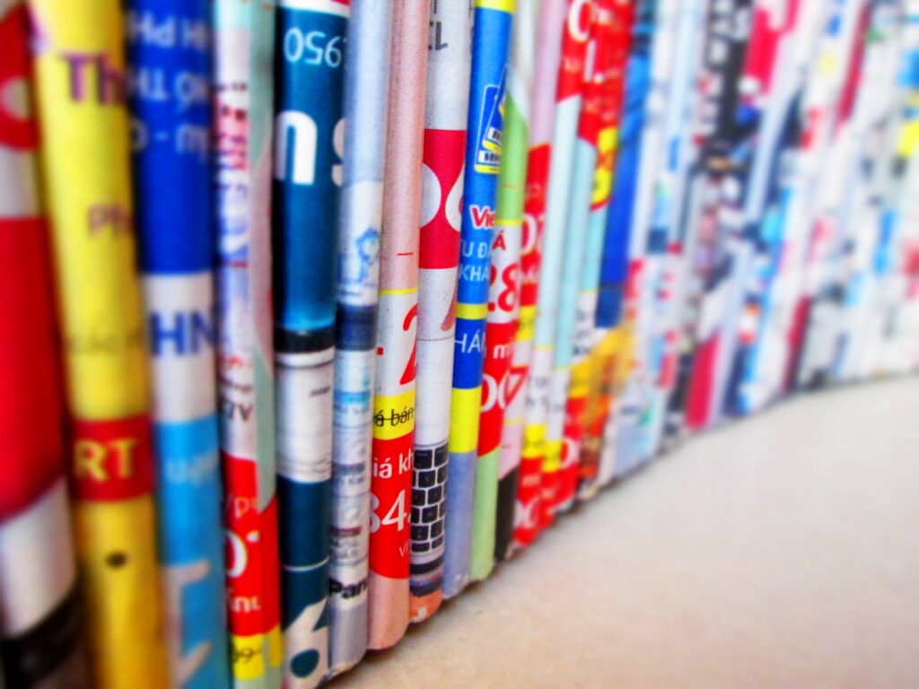 The Art of Drawing Readers In: Your attractive post title goes here Vibrant, assorted rolled magazines create a colorful display.